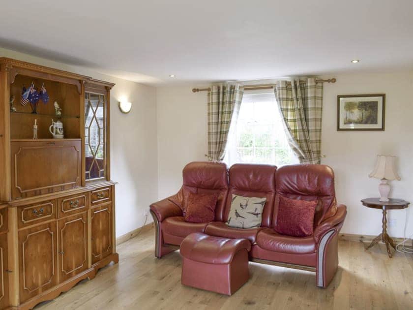 Ample comfy seating within living room | The Ploughmans - Loch Lomond Farm Cottages, Balfron Station, near Stirling