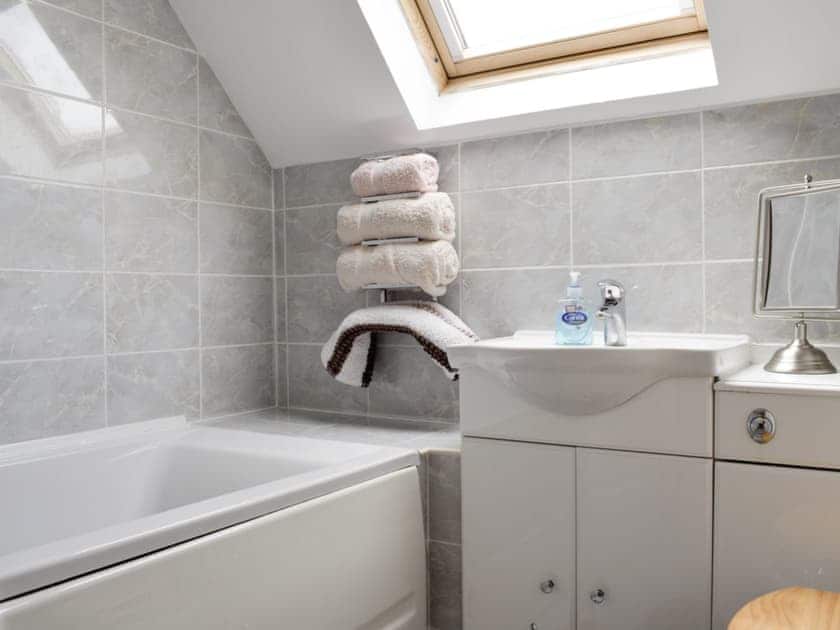 Bathroom with shower above bath | The Ploughmans - Loch Lomond Farm Cottages, Balfron Station, near Stirling