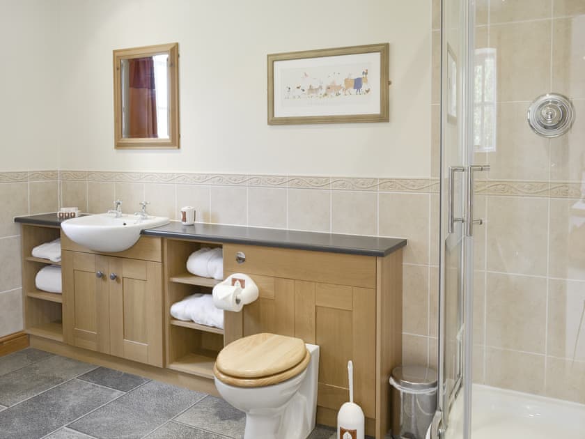 En-suite bathroom with shower cubicle and bath | Bank Top Cottage, Cropton, near Pickering