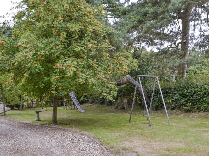 Children’s play area within garden | Thatched Cottage, Witton, near North Walsham