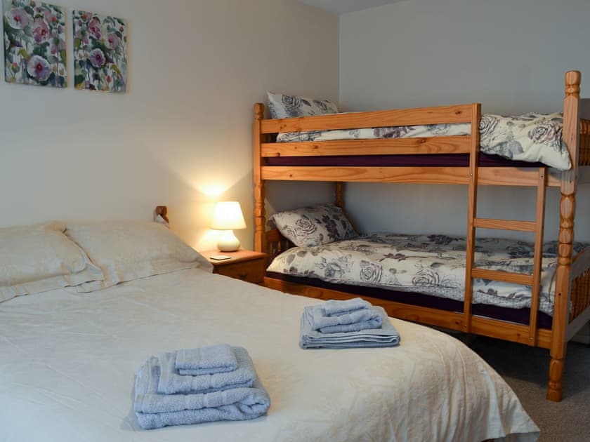 Double bedroom with additional bunk beds | Hideaway Cottage, Kingsgate, near Broadstairs