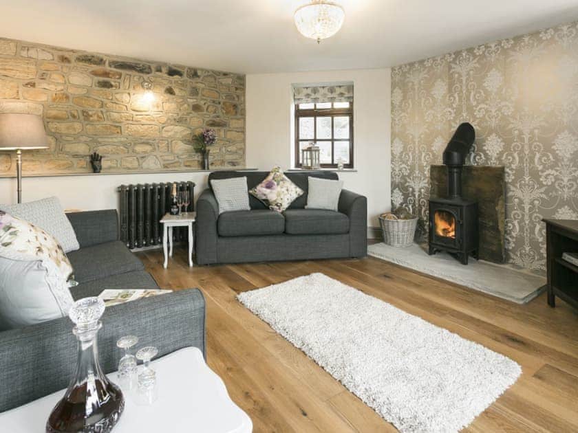 Thoughtfully furnished cosy living room with wood burner | The Old Church, Alton, near Chesterfield
