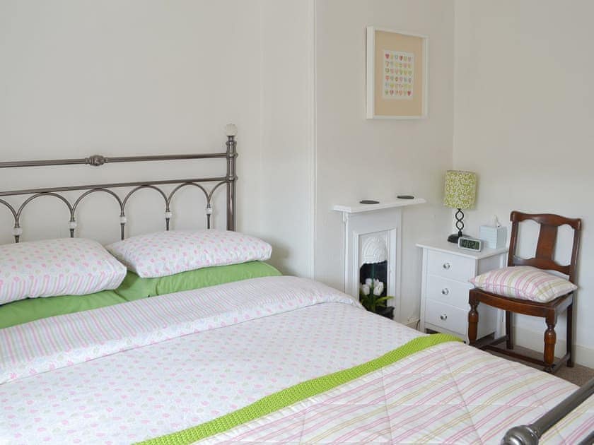 Welcoming double bedroom with antique-style bed | Lavender Cottage, Buckfastleigh
