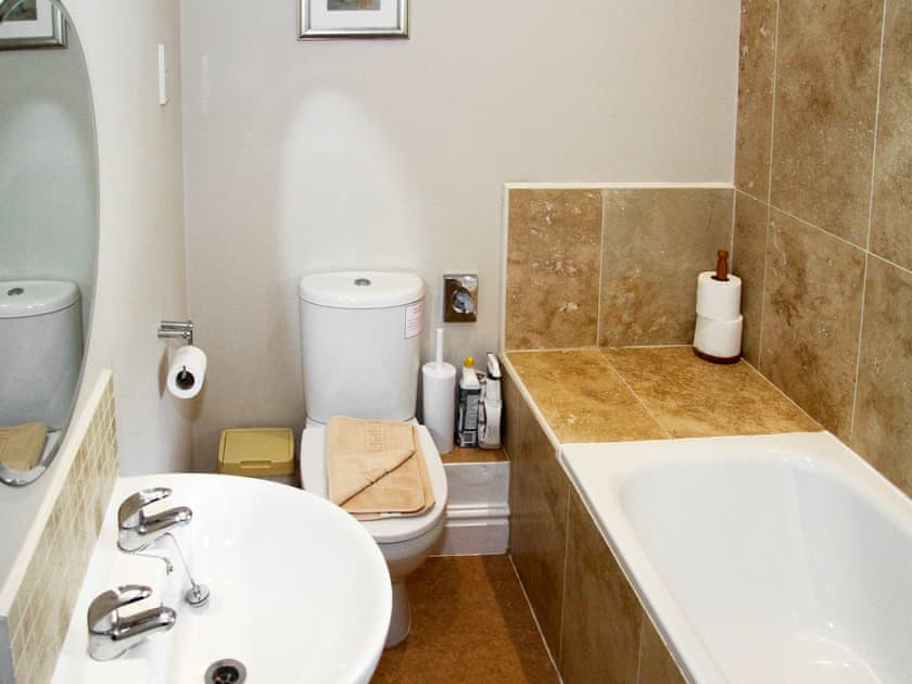 Bathroom with shower over bath and heated towel rail | Howe End, Mungrisdale, near Keswick