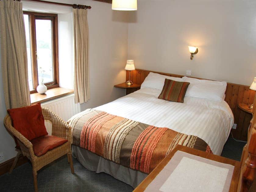 Relaxing bedroom with zip and link king-size bed | Saddleback Barn, Mungrisdale, near Keswick