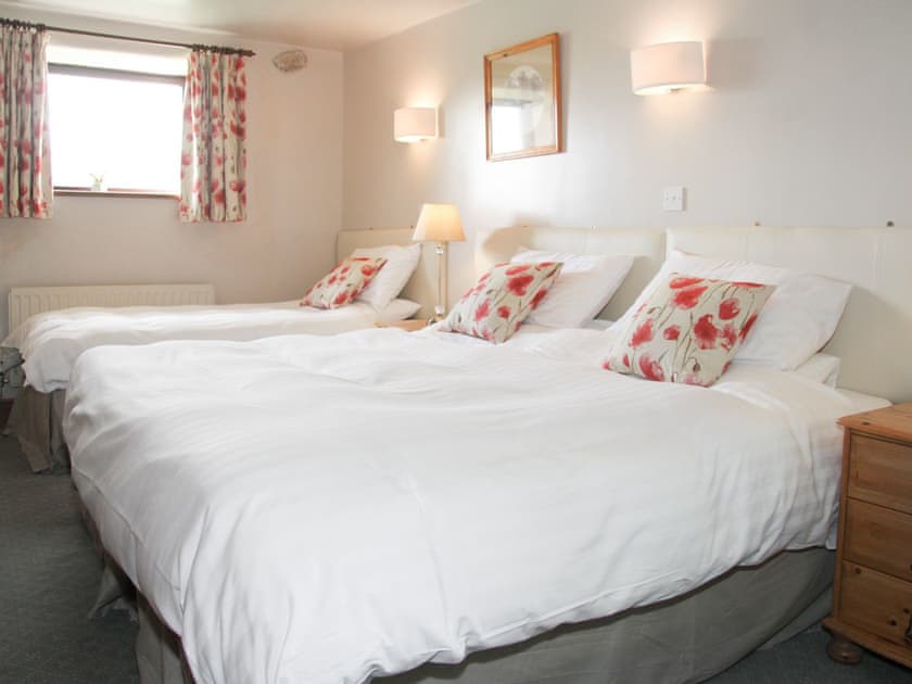 Peaceful bedroom with zip and link king-size bed and single bed | Saddleback Barn, Mungrisdale, near Keswick