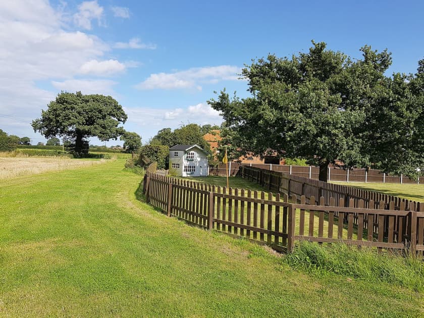 Fenced play area for children | Summer House Stables, Catfield, near Stalham