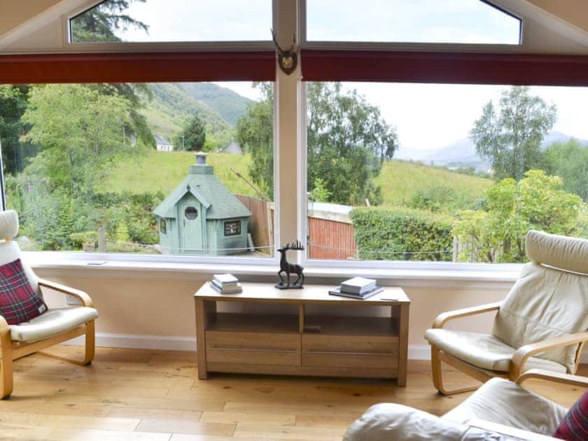 Welcoming sun room overlooking the stunning views | River Mill House, Ballachulish, near Fort William