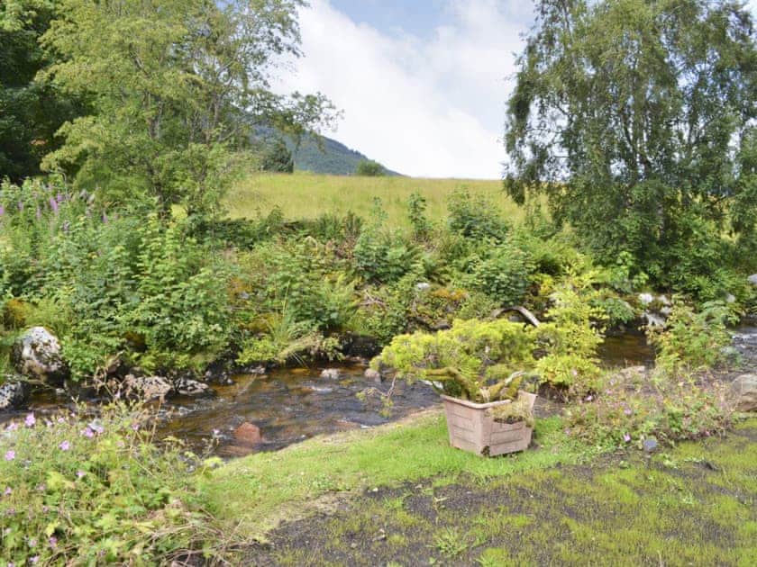 A gentle stream flows next to the garden | River Mill House, Ballachulish, near Fort William