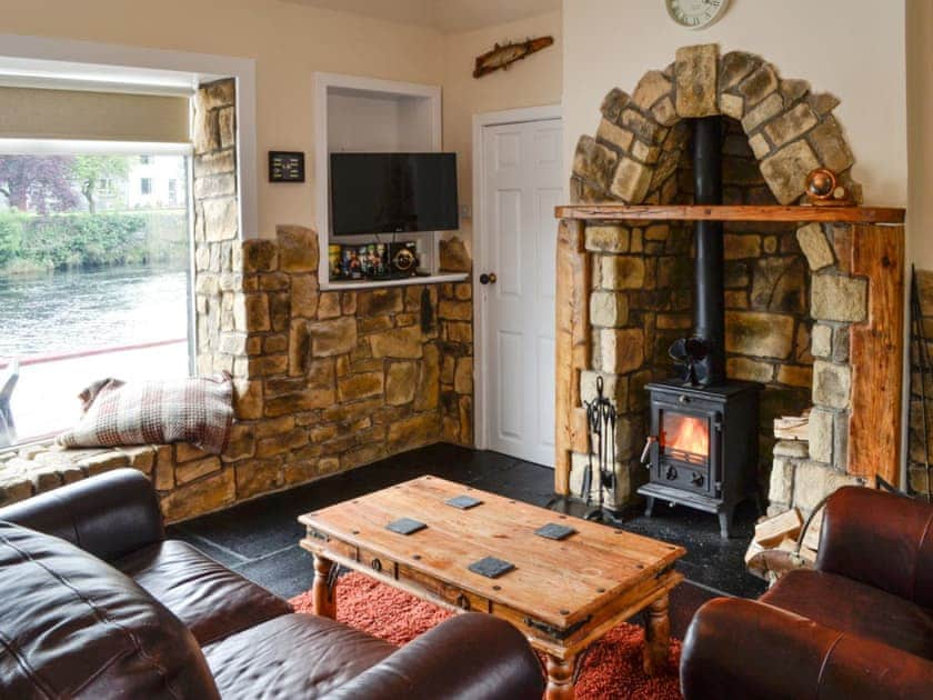 Cosy living room with wood burner | Minnow Cottage, Minnigaff, near Newton Stewart