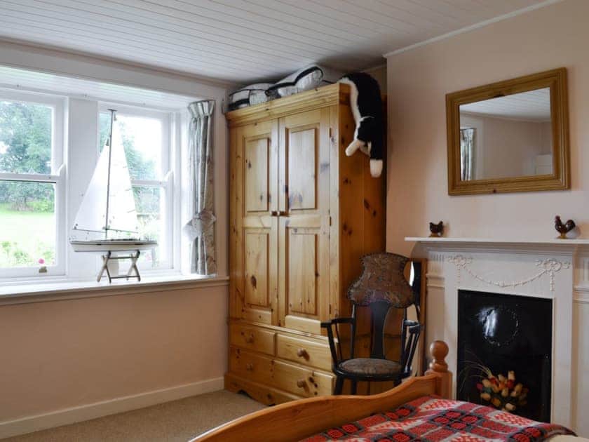 Tastefully furnished bedroom with scenic views | Gullieside Cottage, Kirkandrews, near Kirkcudbright