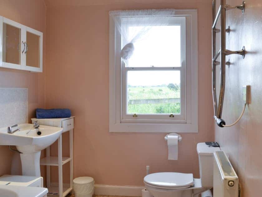 Bathroom with shower over bath and heated towel rail | Gullieside Cottage, Kirkandrews, near Kirkcudbright