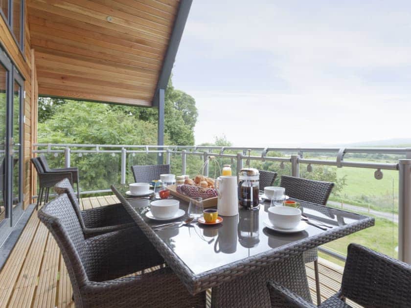 Decked balcony accessed via the living area | Strathspey Lodge, Duthil, Carrbridge, near Aviemore