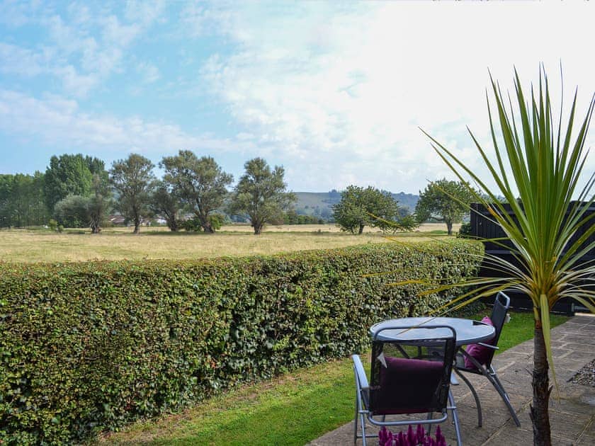 Delightful sitting out area with wonderful rural views | Treacle Cottage - The Treacles, West Hythe, near Romney Marsh
