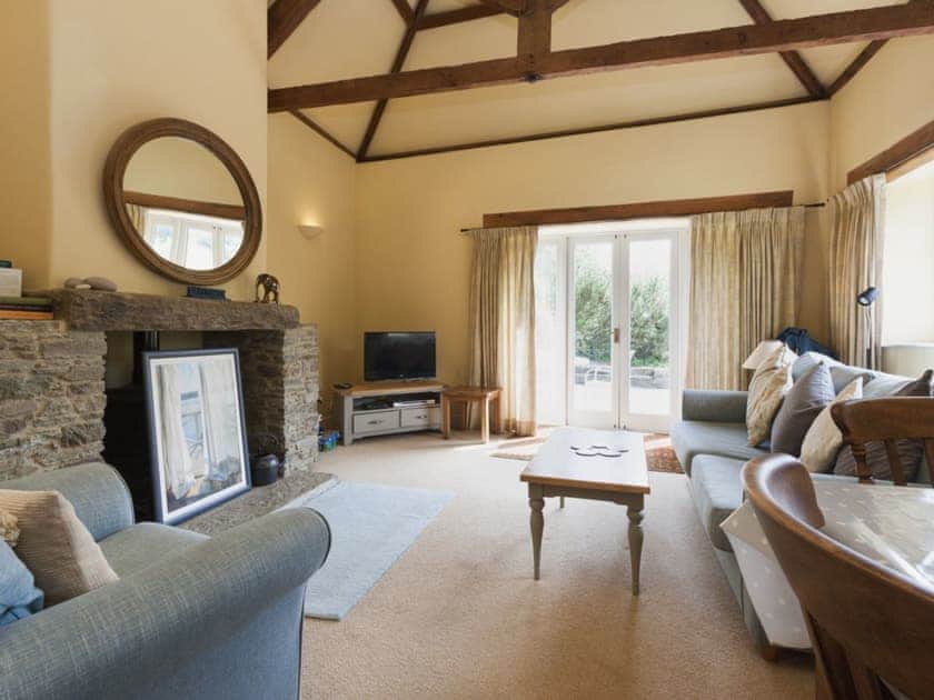 Open plan living space with vaulted and beamed ceilings | Hanger Mill Barn, Salcombe
