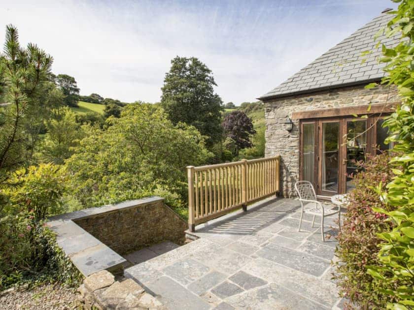 Patio with garden furniture and fantastic valley views | Hanger Mill Barn, Salcombe