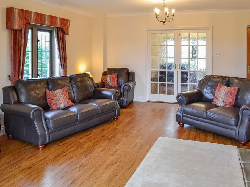 Comfortable leather furniture and wooden floors | Canon Court Farmhouse, Milborne Port, near Sherborne
