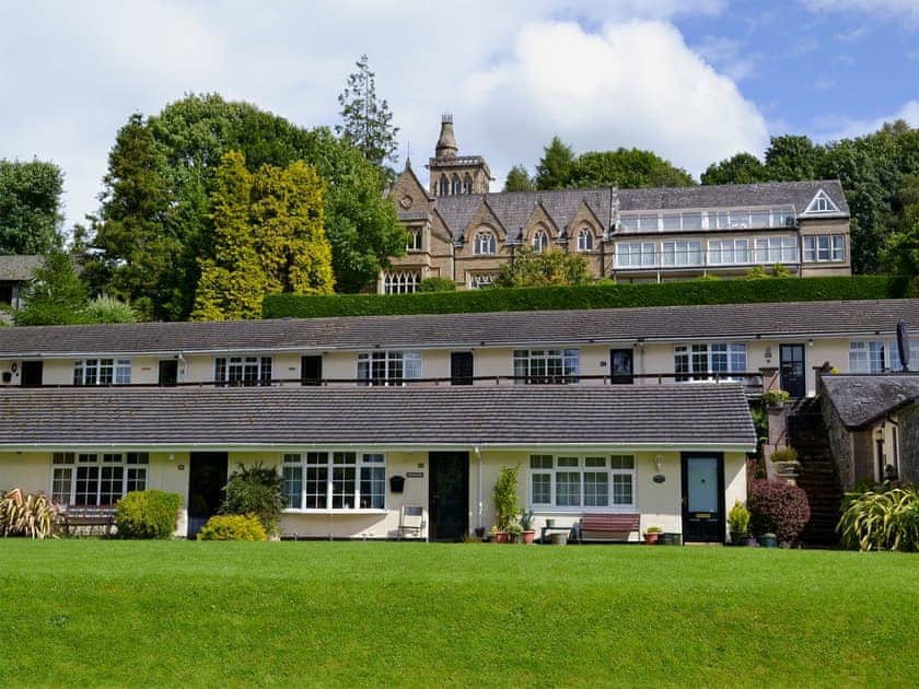  In an elevated position on a grassy bank in front of the elegant former Priory Hotel | Gone Sailing, Windermere