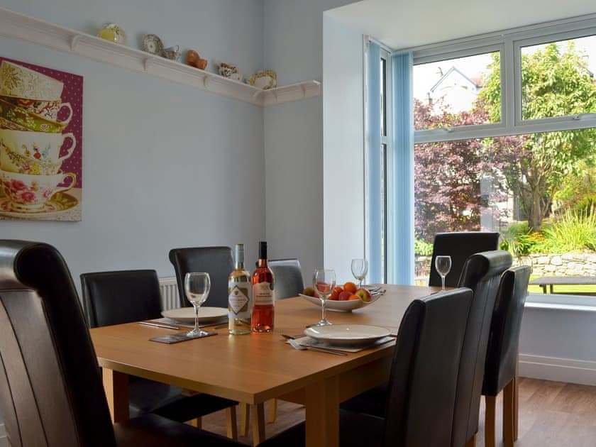 Inviting dining area overlooking the delightful garden | The Moorings, Grange-over-Sands