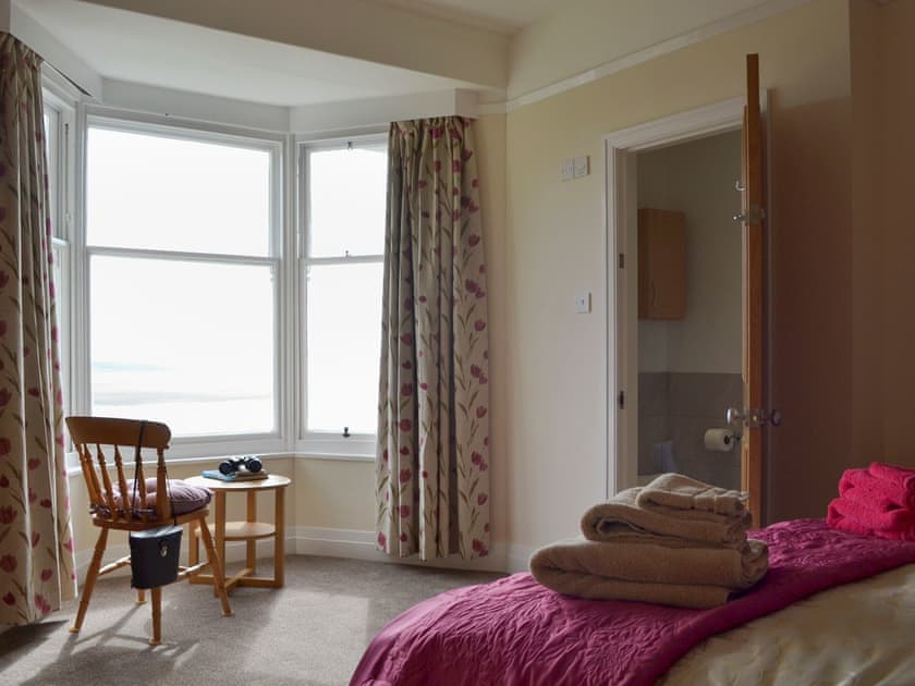 Peaceful bedroom with king-size bed and en-suite | The Moorings, Grange-over-Sands