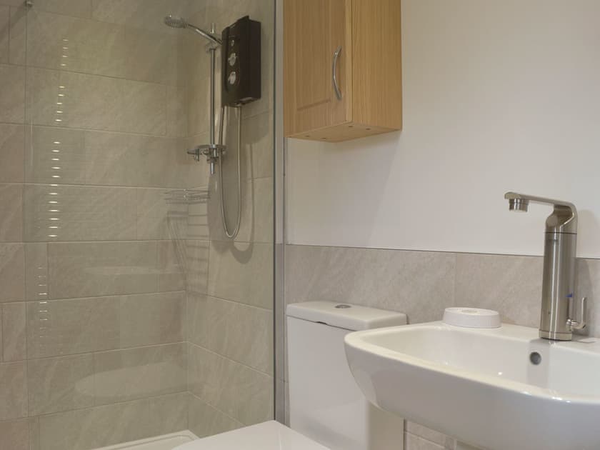 En-suite shower room with shower cubicle and heated towel rail | The Moorings, Grange-over-Sands