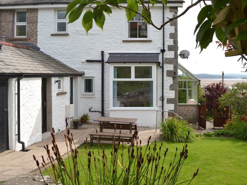 Spacious enclosed terraced garden overlooking the scenic views  | The Moorings, Grange-over-Sands