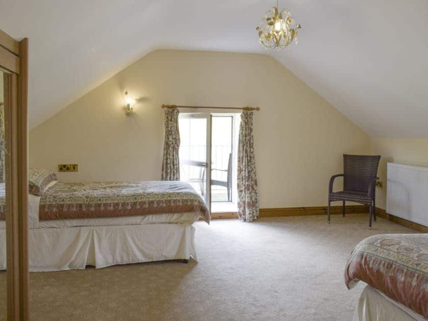 Large family bedroom with a double and a single bed | No 1 Pengraig Draw - Pengraig Cottages, Near Llanfarian