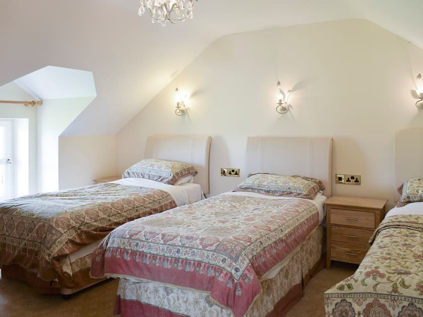 Second bedroom with 3 single beds and a sofa bed | No 1 Pengraig Draw - Pengraig Cottages, Near Llanfarian