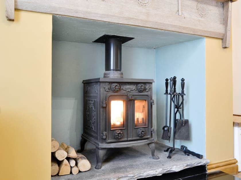 Warm and welcoming wood burner | Skelmorlie Cottage, Portinscale, near Keswick