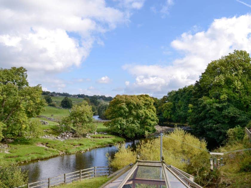 Expansive views from the rear over the River Wharfe. | Inglenook Cottage, Linton Falls, near Grassington