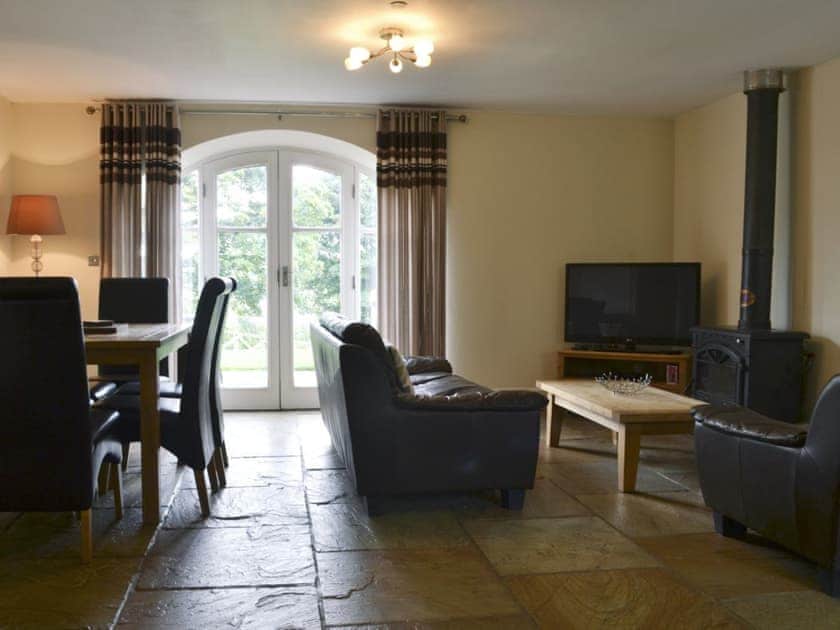 Comfortable lounge with wood burner and Freeview TV | Raby Cottage - Bowlees Holiday Cottages, Wolsingham, near Stanhope