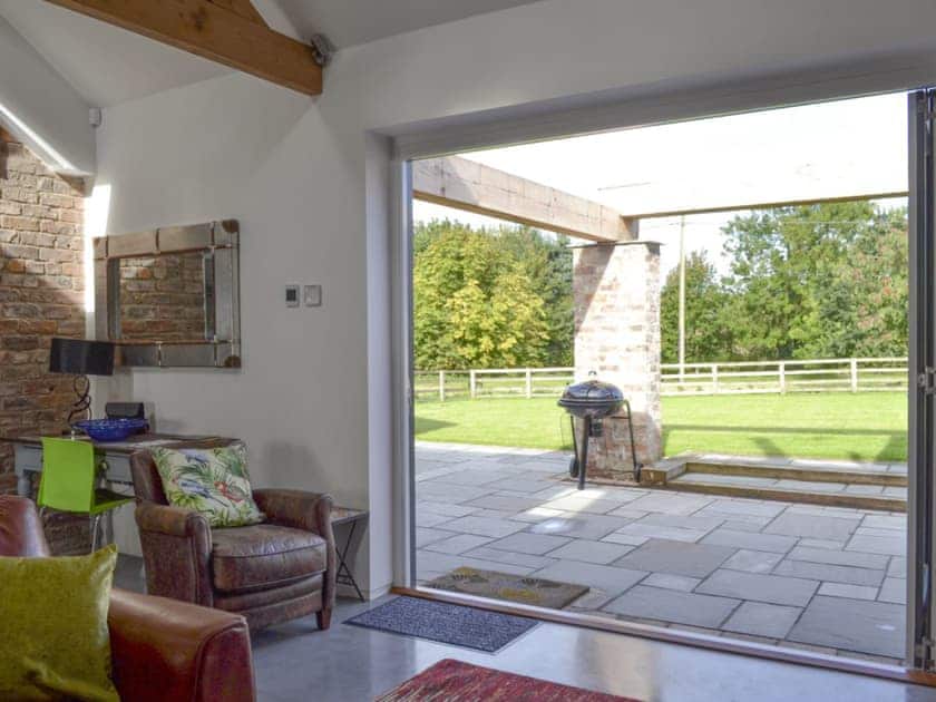 Bi-fold doors from living area to patio | Bluebell Barn, Dunnington, near York