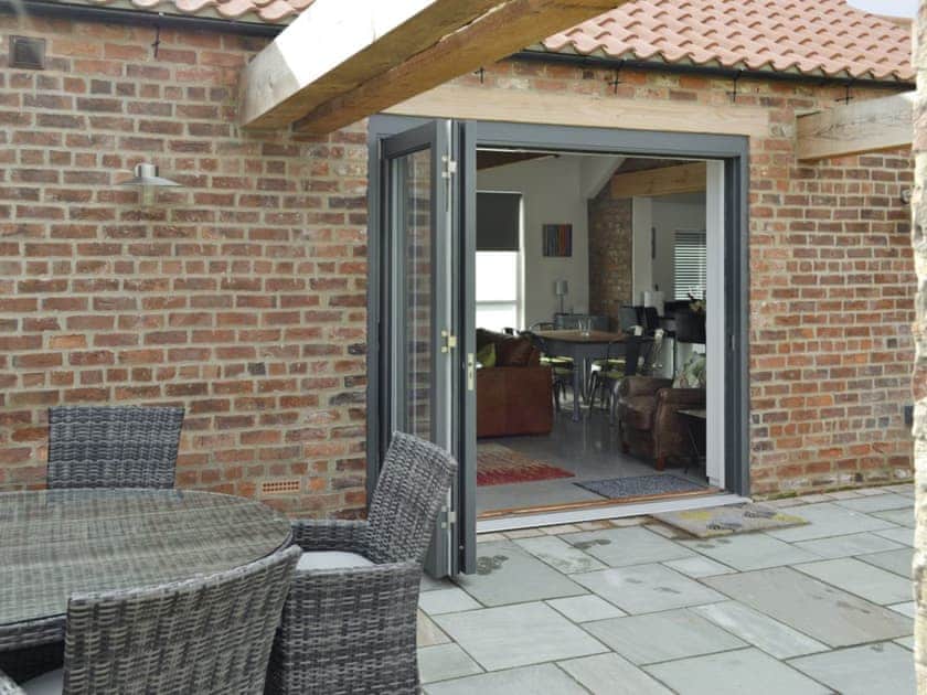 Bi-fold doors from patio to living area | Bluebell Barn, Dunnington, near York