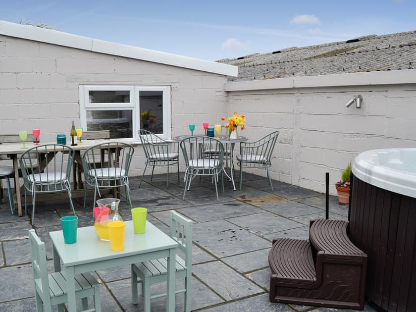 Hot tub and patio with dining area | Bryn Boda, Nantglyn, near Denbigh