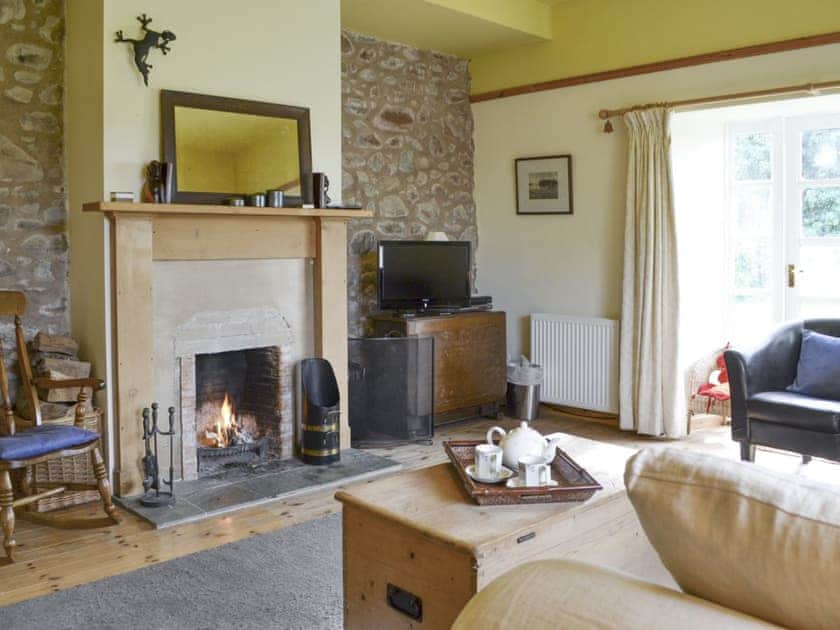Welcoming living room with French doors to garden | Hume Orchard Steading, Hume, near Kelso