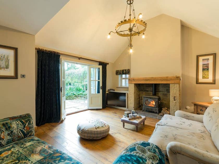 Comfy Living room with wood burner and French doors leading to garden | The Coach House, Riding Mill, near Corbridge