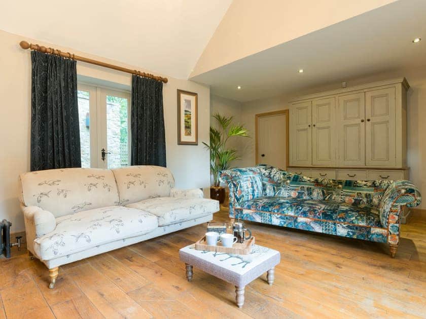 Comfy Living room with wood burner and French doors leading to garden | The Coach House, Riding Mill, near Corbridge