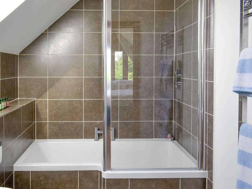 Modern bathroom with shower over bath | The Forge, Thorncombe, near Broadwindsor