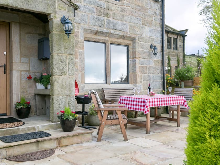 Attractive patio area with sitting out area | Commons Farm Cottage, Wadsworth, near Hebden Bridge