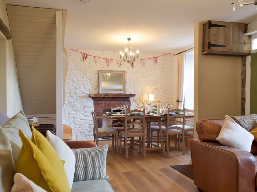 Attractive and warm living and dining room | Moss Cottage, Burry Port, near Llanelli