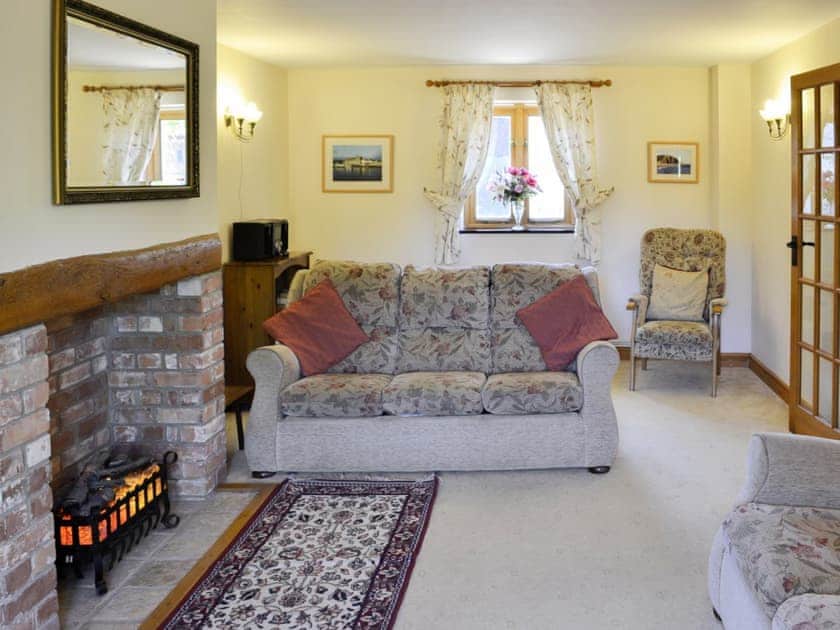Lovely living room with feature fireplace | Carters Cottage - The Old Timberyard, Puncknowle, near Dorchester