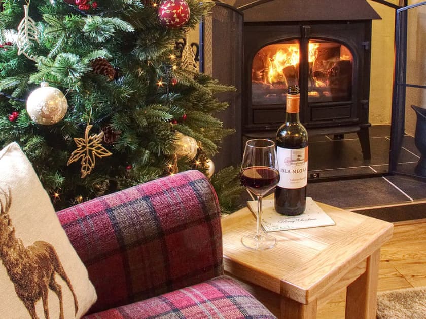 Cosy living room with woodburner | Fferam Gorniog, Holyhead Mountain, near Trearddur Bay