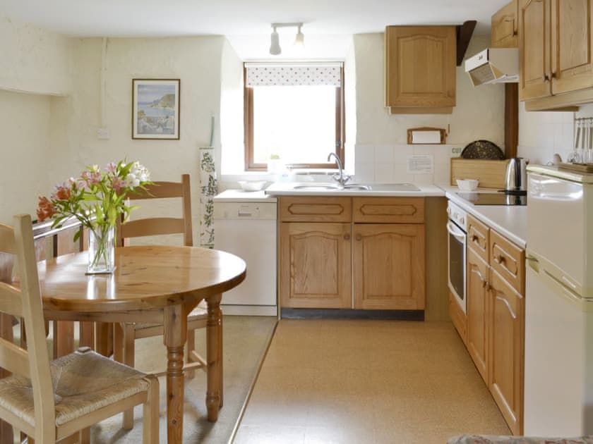 Kitchen and dining area within open-plan design | Duck Pool - Kennacott Court Cottages, Widemouth, near Bude