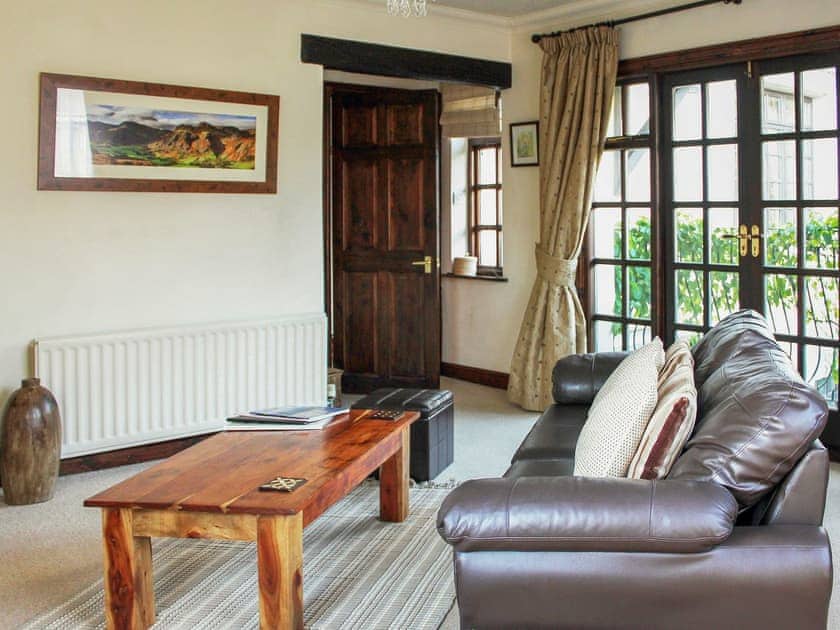 Comfortable living room with French doors | Staveley House Apartment - Staveley House & Staveley House Apartment, Staveley