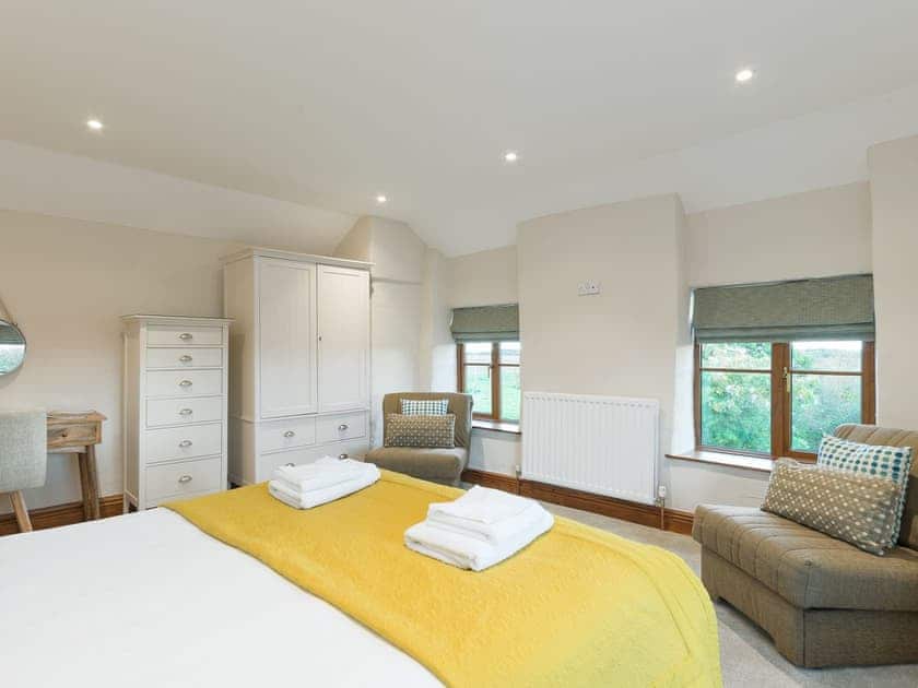Double bedroom, 2 single chair beds (for children) and en-suite with shower over bath  | The Old Mill - The Old Mill Cottages, Little Mill, near Craster