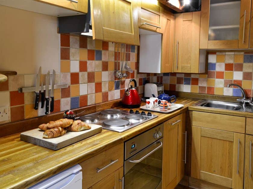 Galley-style kitchen | The Saddlery, Pen-y-Cae, near Ruabon