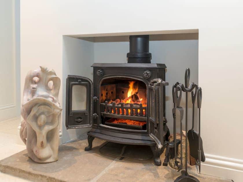 Large dining area with wood burner | The Lodge, North Duffield, near York