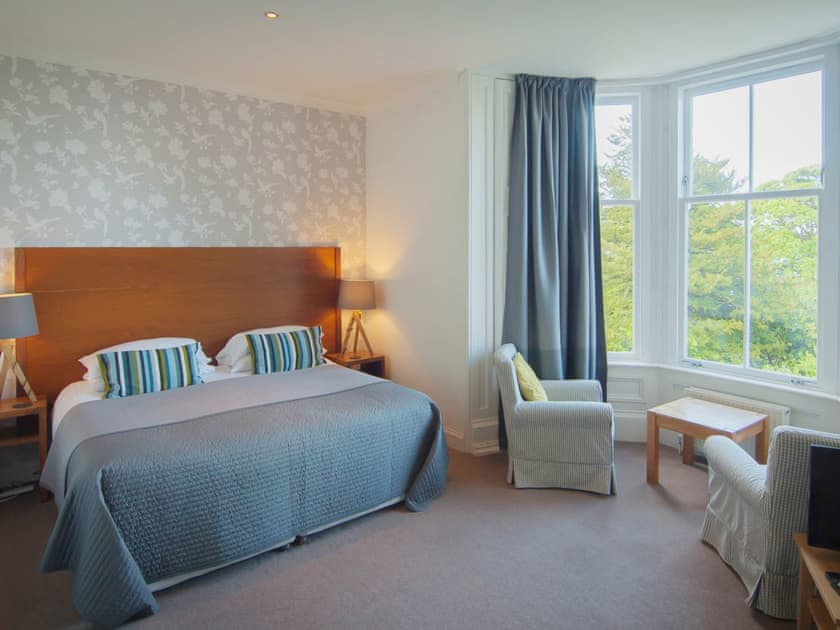 Bedroom with super king size zip and link twin beds | Munro’s, Rothesay, Isle of Bute