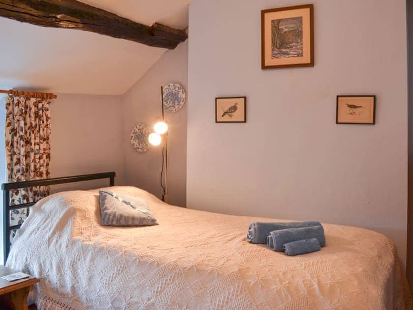 Charming twin bedded room | Upper Stanbatch Cottage, Wentnor, near Bishops Castle
