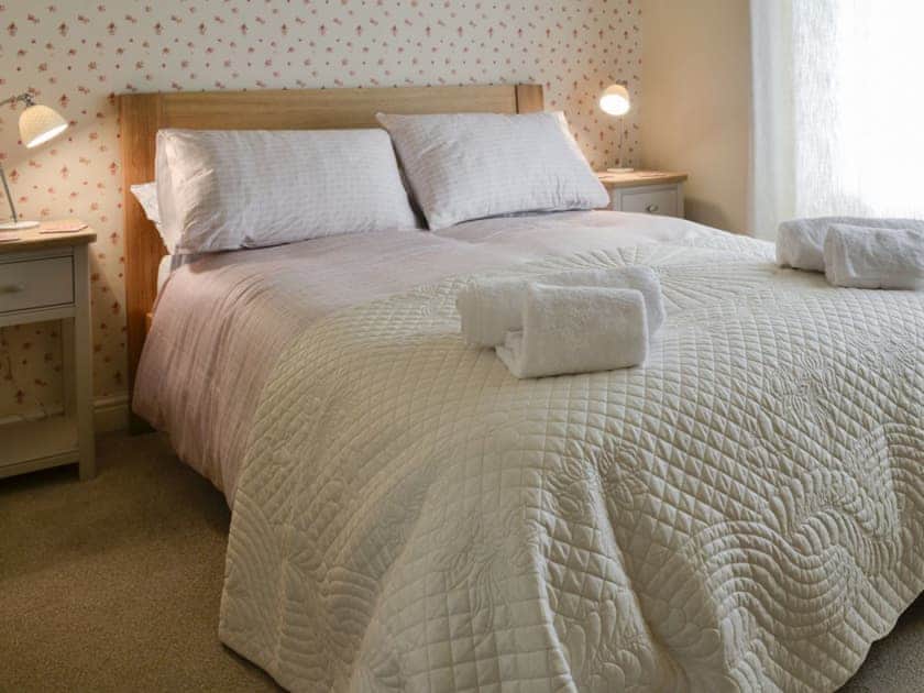 Warm and welcoming double bedroom | Inglenook Cottage, Linton Falls, near Grassington